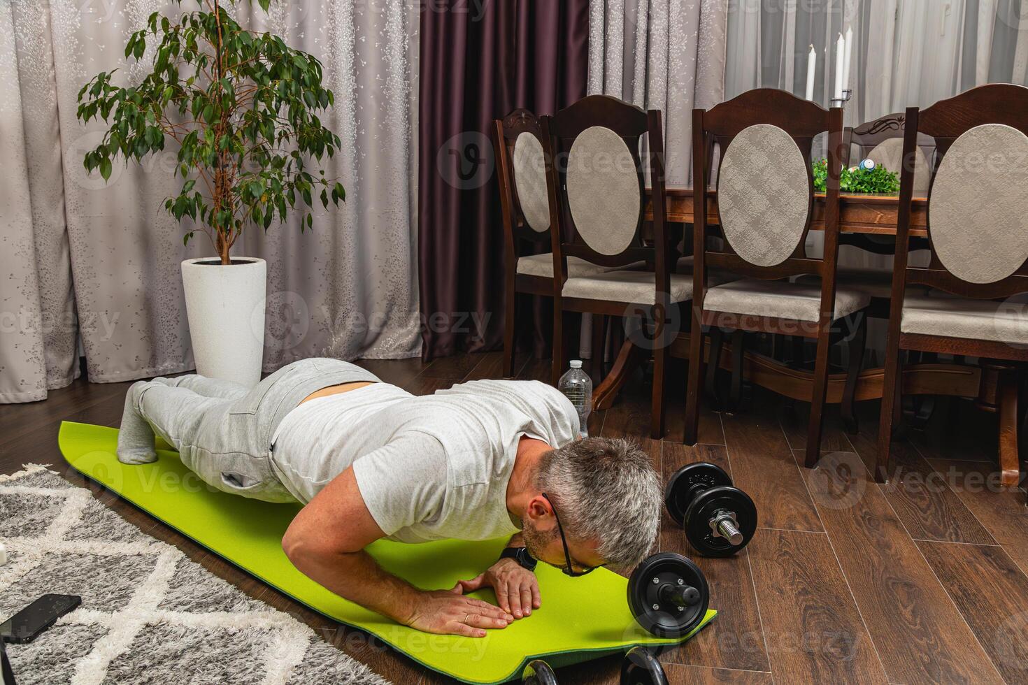 Home workout session with push-ups and weights photo