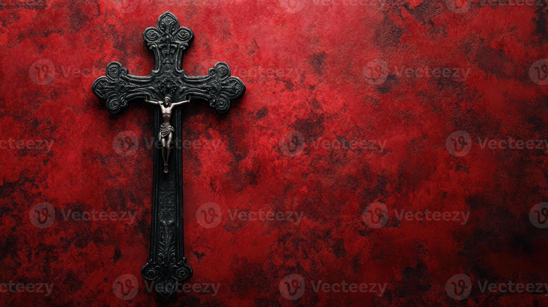 Dark metal crucifix stands out against textured red background evoking dramatic world where Dracula legends meet day fading light photo
