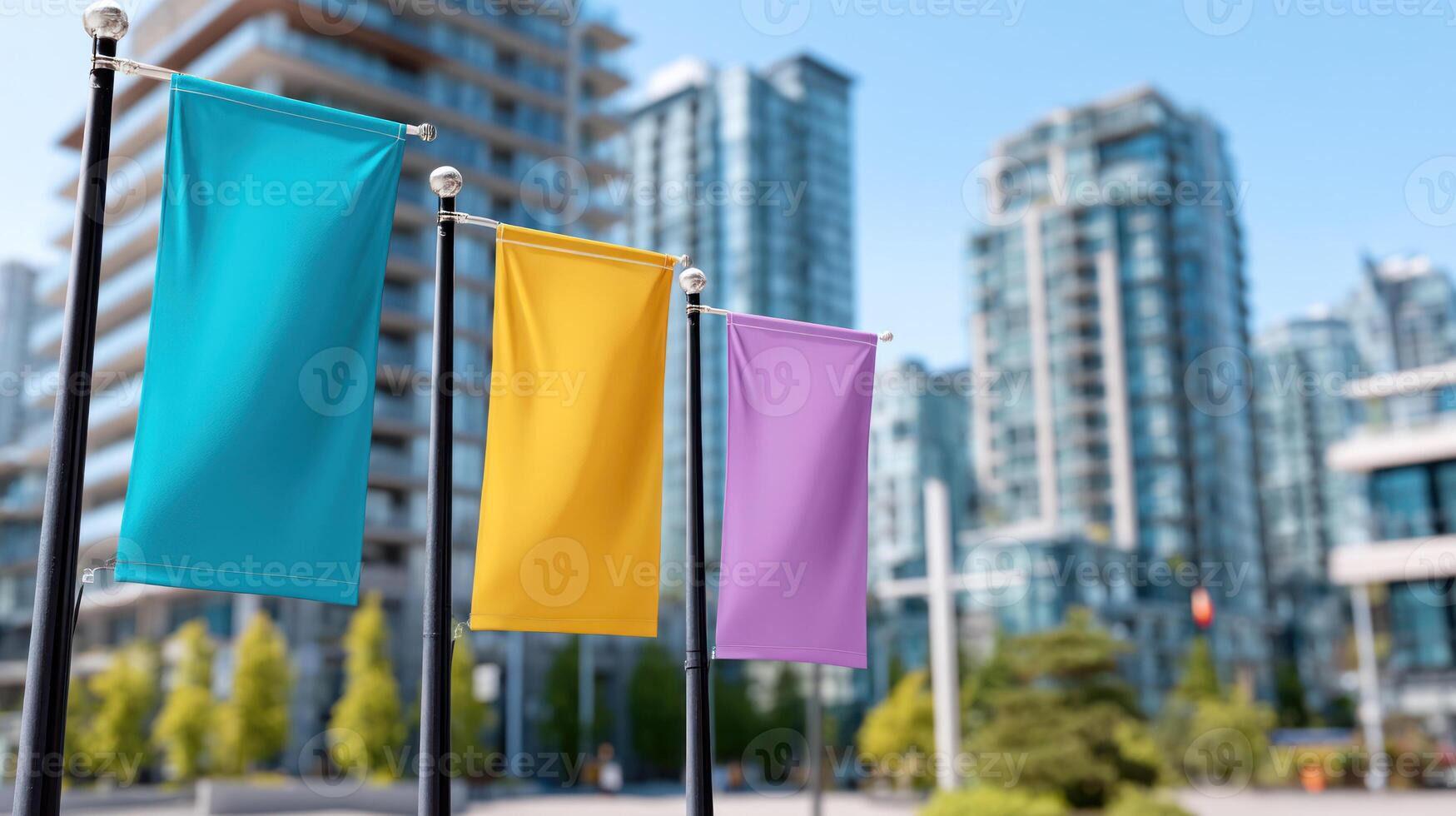 Colorful banners fluttering in light wind in front of modern urban buildings on clear day, creating vibrant city atmosphere photo