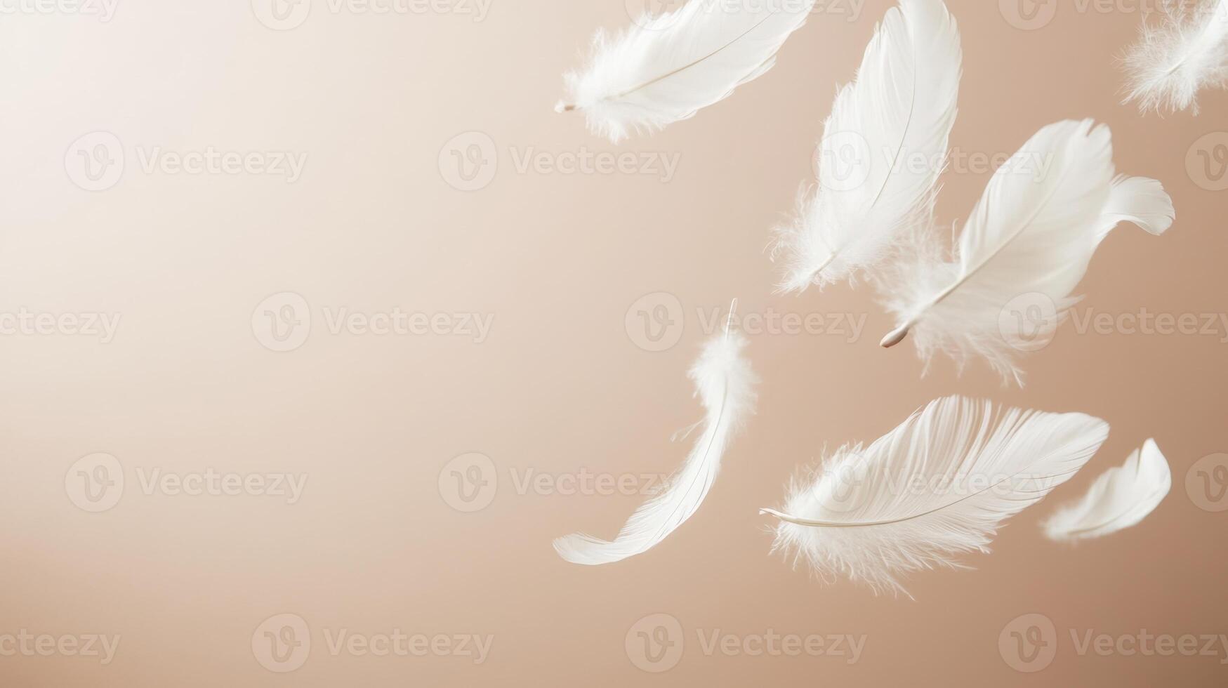 Several soft white feathers gently floating against a smooth, light beige background. Airy and delicate composition with ample copy space photo