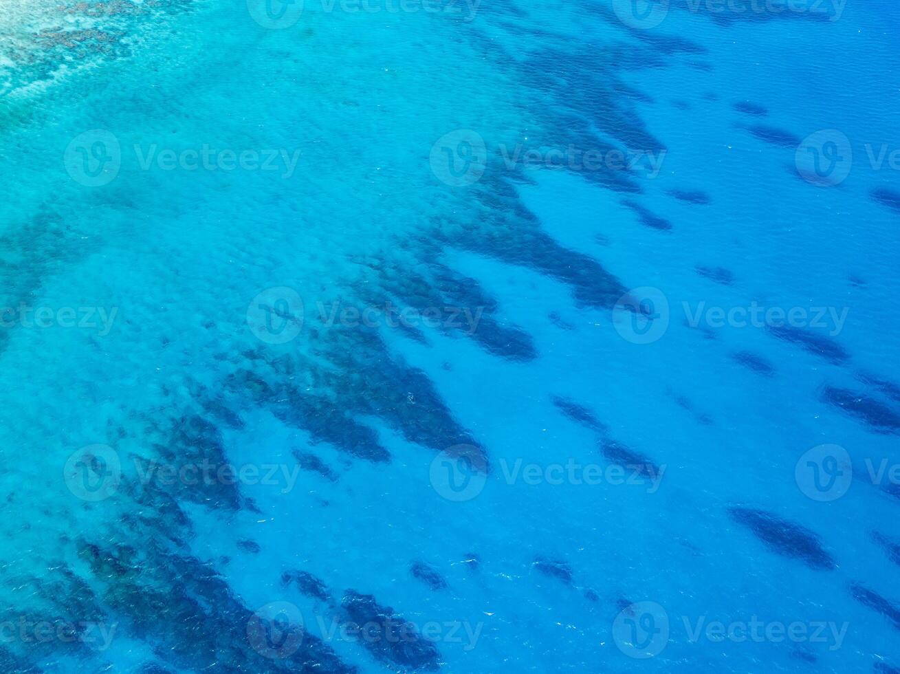 A large body of water with a large coral reef photo