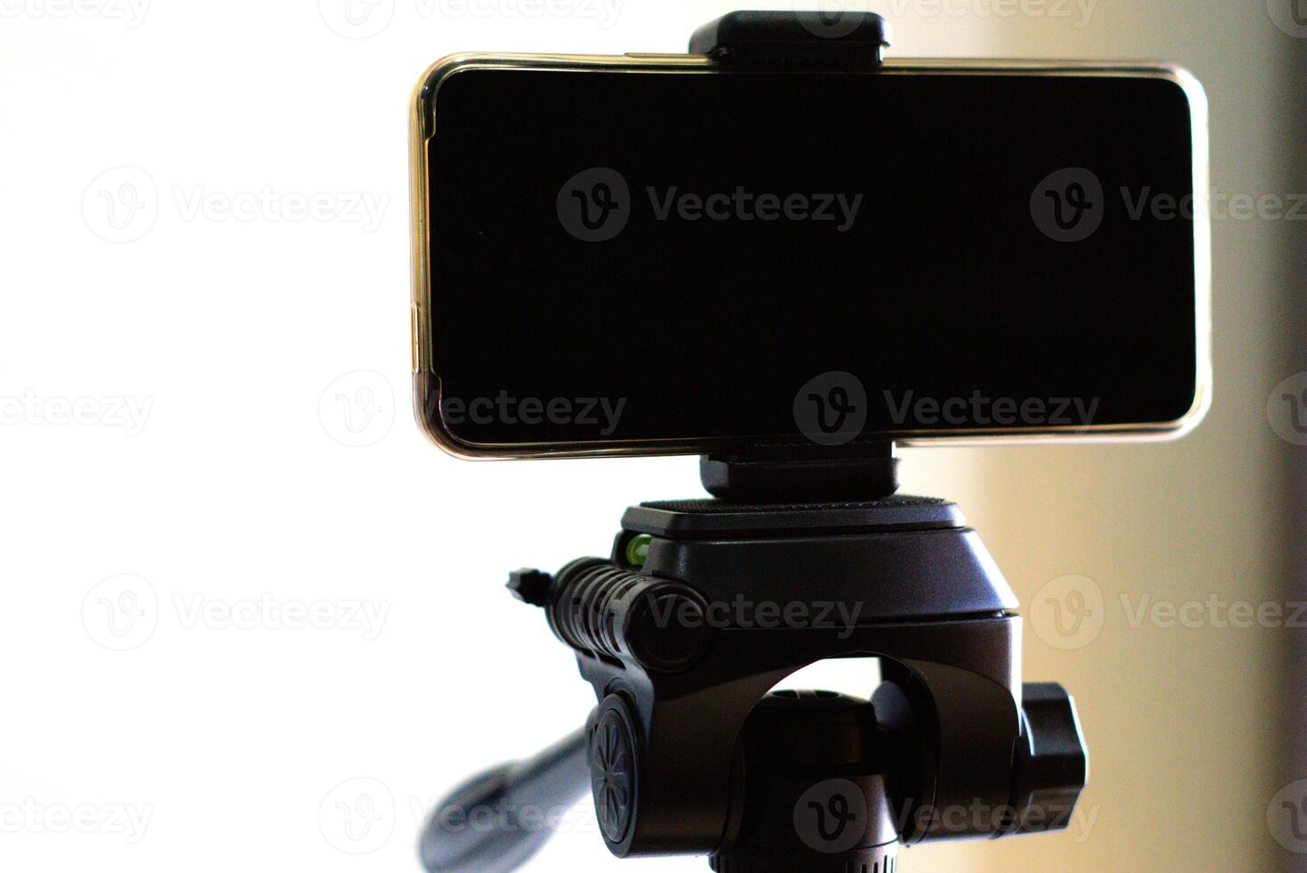 close up of smartphone on a tripod photo