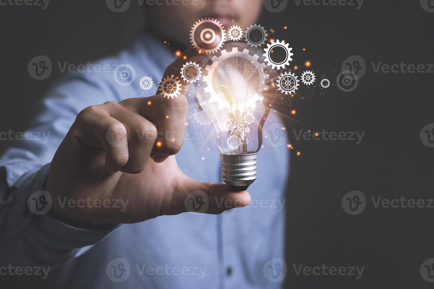 Concept of Ideas for presenting new ideas Great inspiration and innovation new beginning with Businessman holding light bulbs. photo