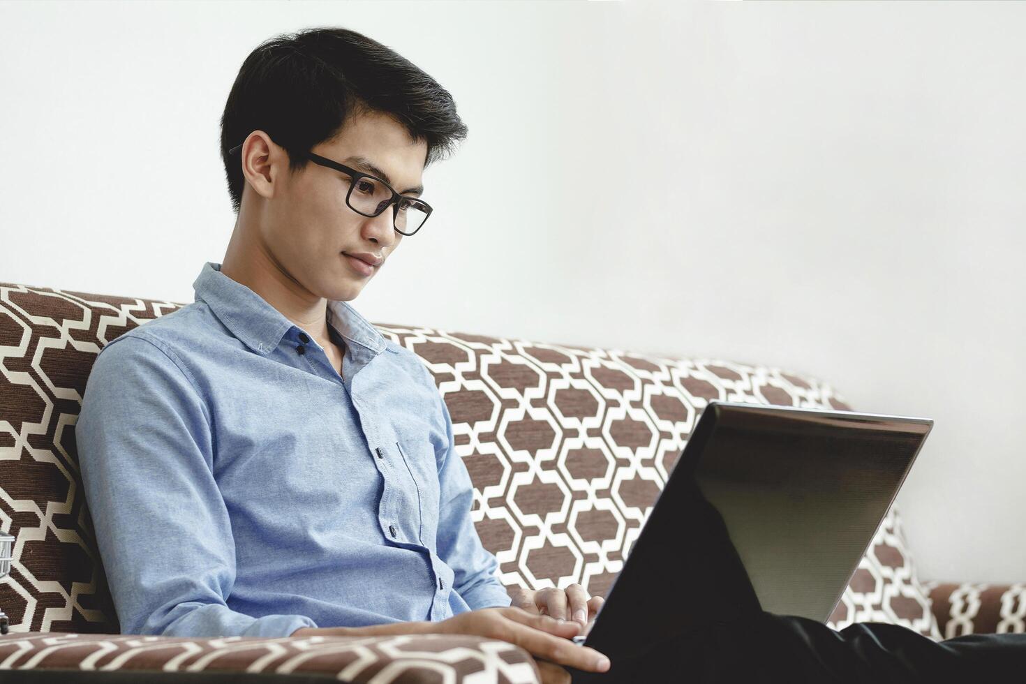 Young adults are using laptop to learn and research online. photo