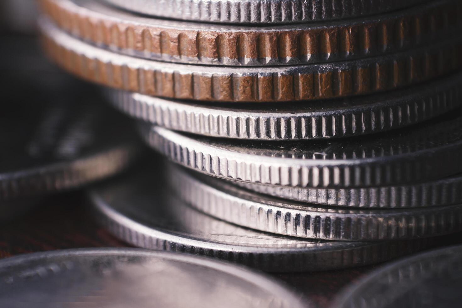 Coin Closeup The concept of currency appreciation or saving in an economic crisis, the recession of currencies, investments and shares fall into the spread of coronavirus. And scooping out at home photo