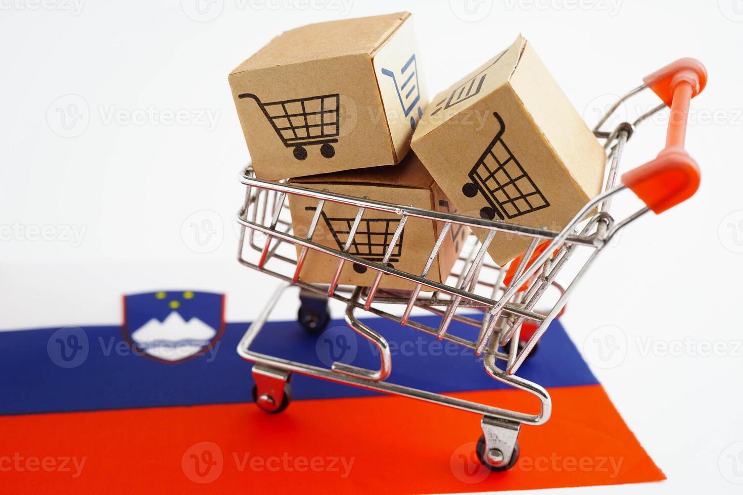 Online shopping, Shopping cart box on Slovenia flag, import export, finance commerce. photo