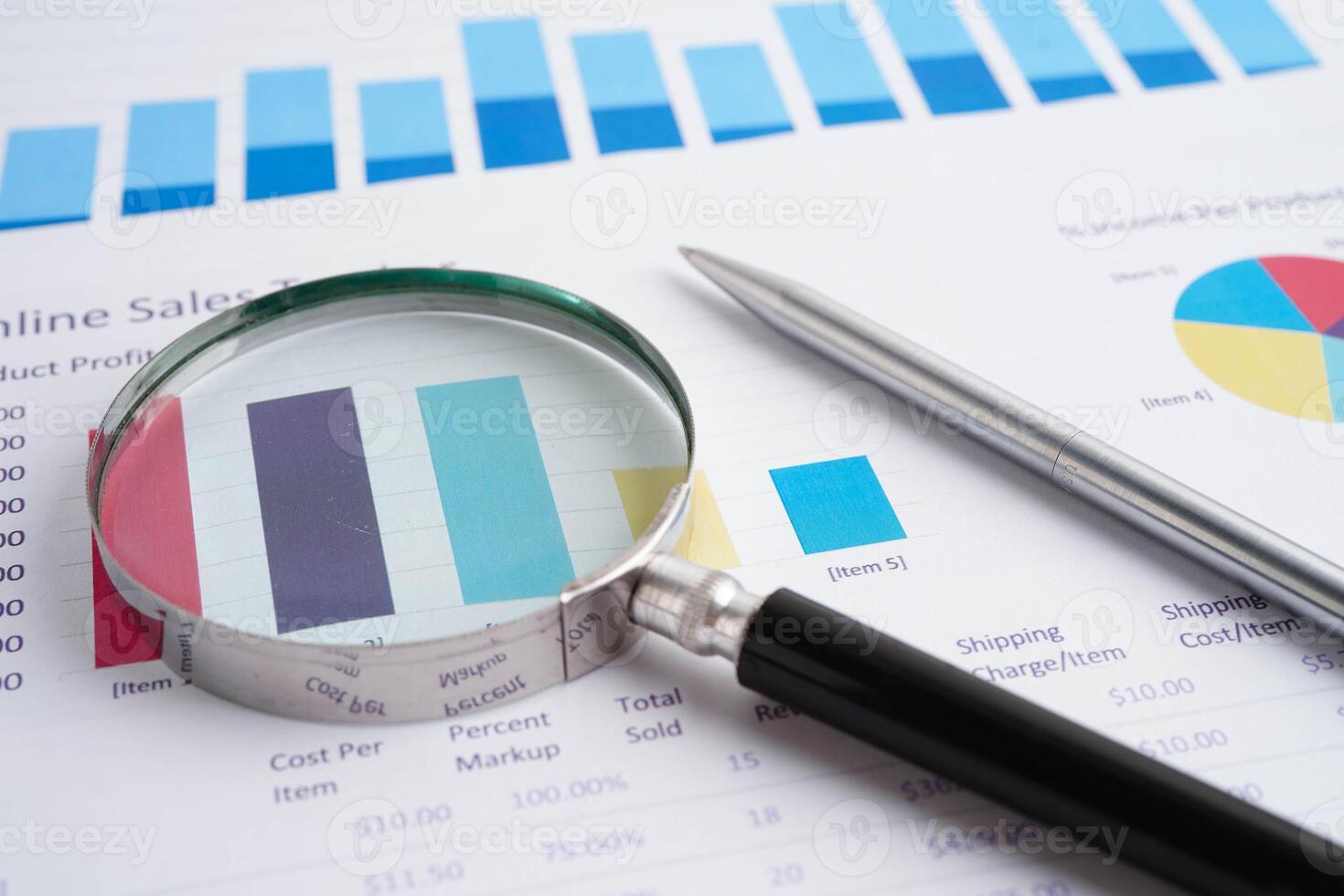 Magnifying glass on charts graphs paper. Financial development, Banking Account, Statistic, Investment Analytic research data eco photo