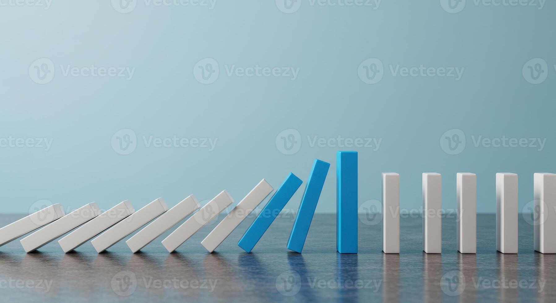 Domino effect shown with blue blocks stopping the fall of white blocks, representing intervention, solution and problem solving concept. photo