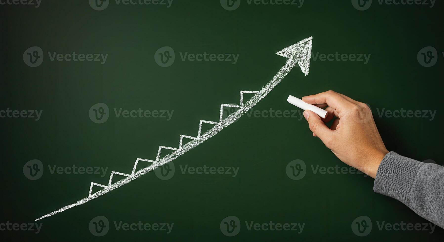 Hand drawing upward trending ladder arrow with white chalk on green chalkboard, concept of growth and progress. photo
