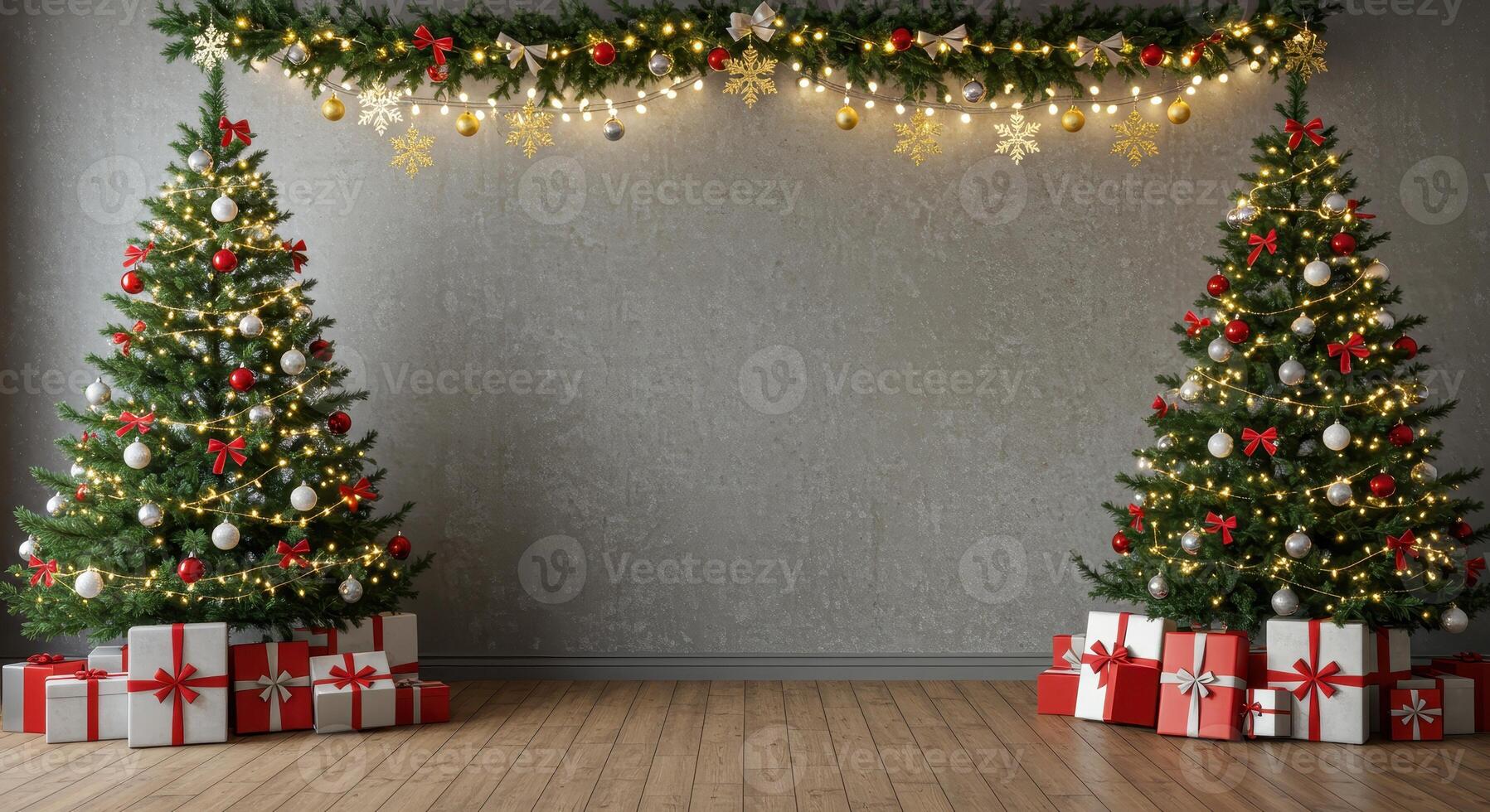 Two decorated Christmas trees with lights, ornaments, and gifts against a gray wall with a garland. Festive holiday scene with copy space. photo
