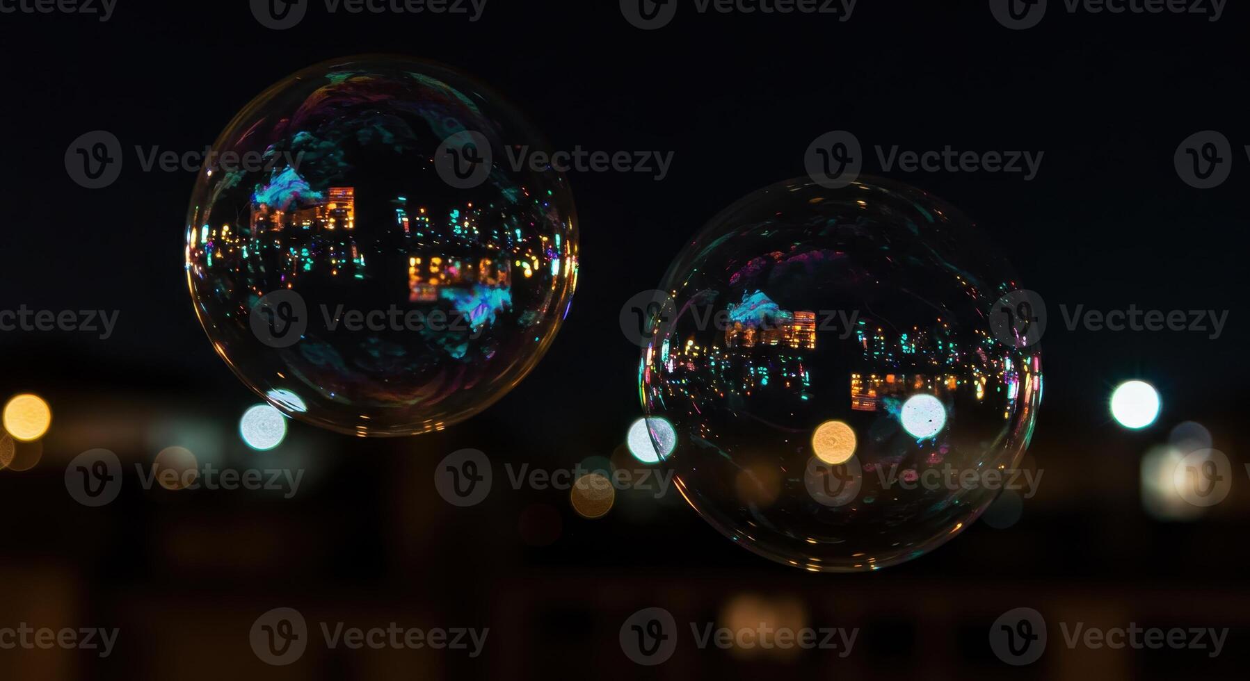 Two soap bubbles float with city lights reflecting on their surface, creating an urban abstract and adding a touch of whimsy to the night scene. photo