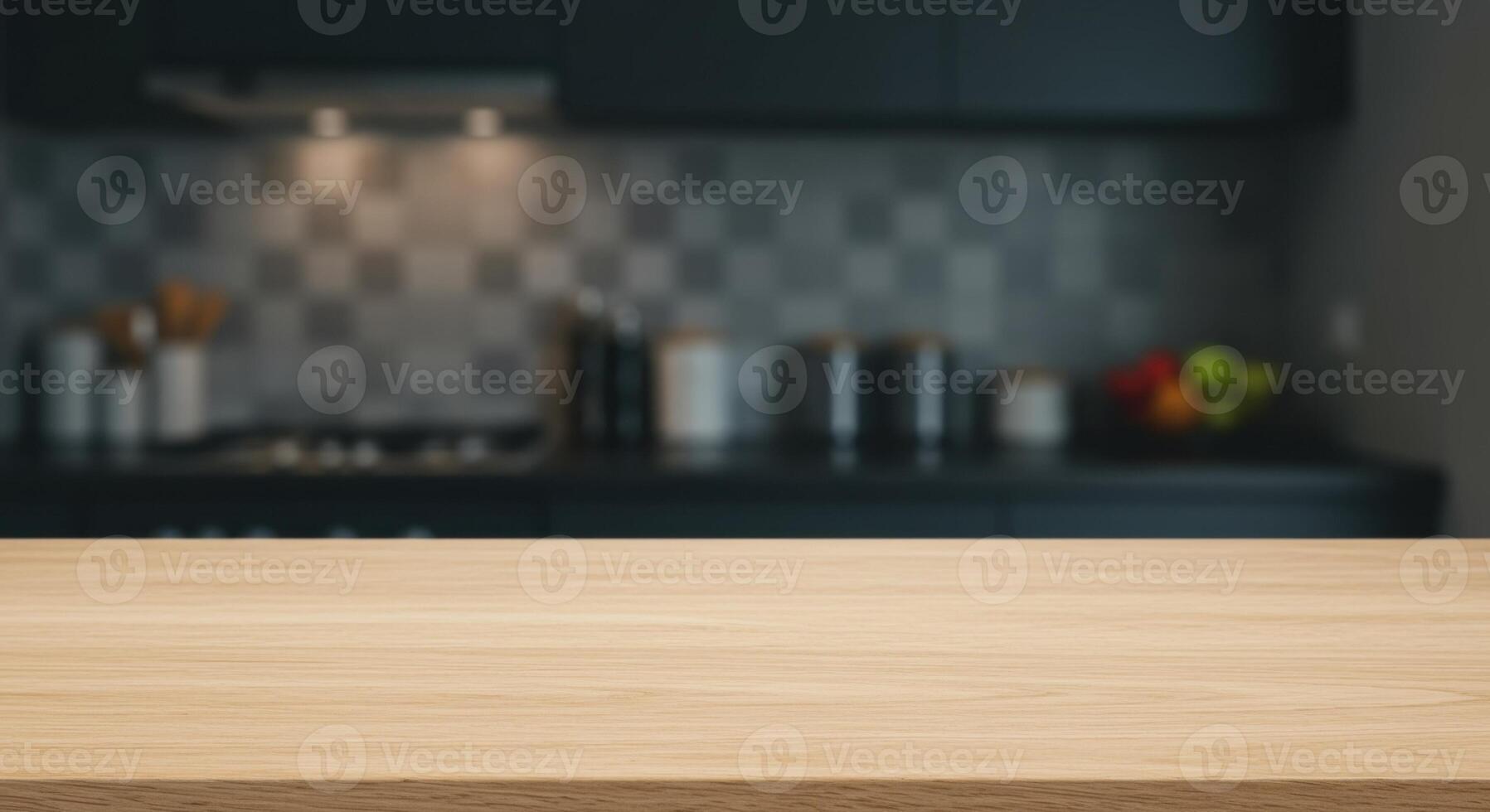 Clean light colored wooden plank countertop with visible wood grain in foreground, smooth surface, and blurred kitchen in background. photo