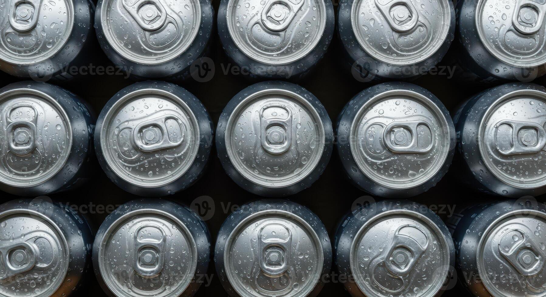 Rows of aluminum cans with water droplets, close up overhead view. Cold beverage concept, refreshment, drink industry, metal container. photo