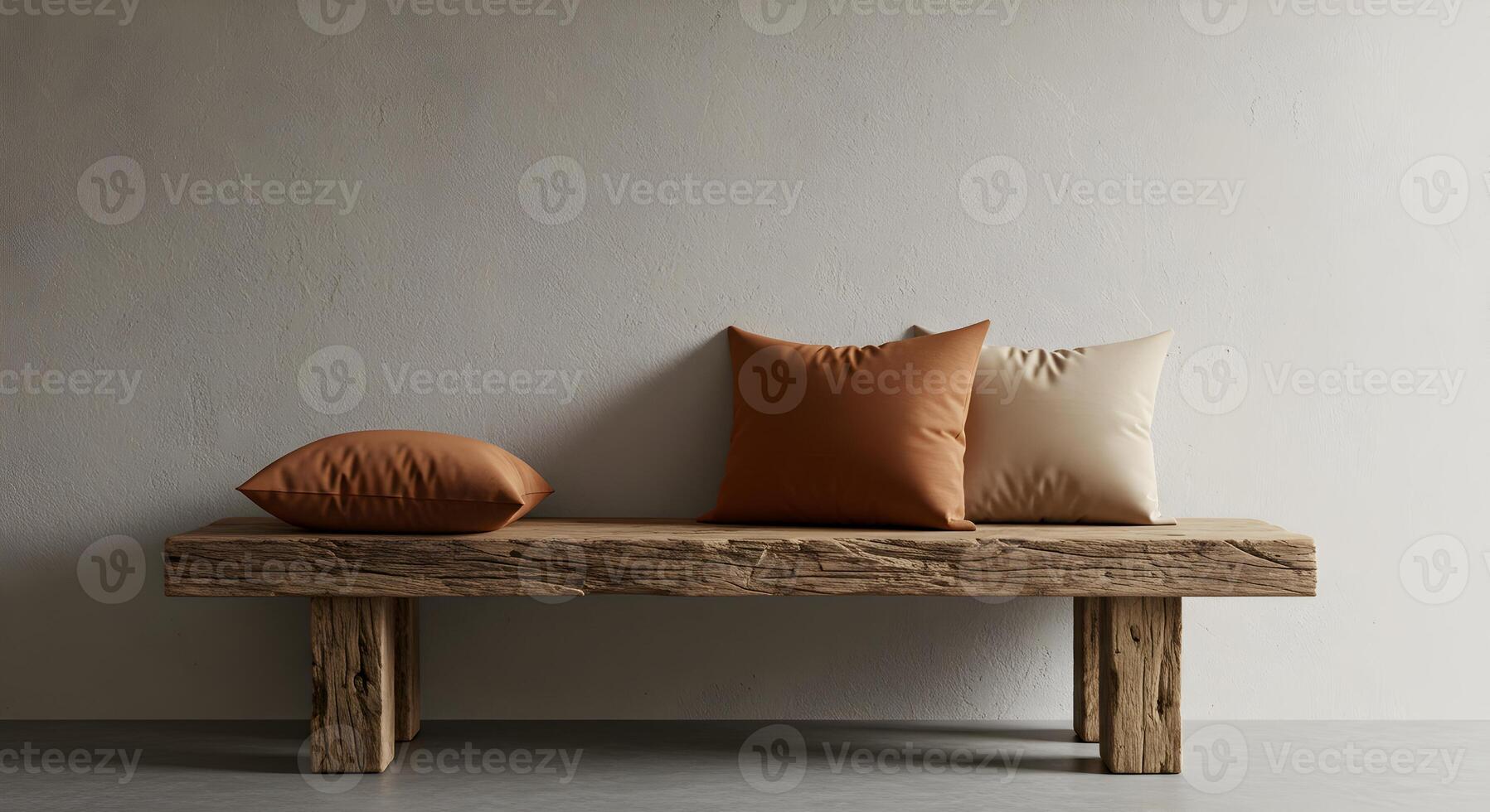 Rustic wooden bench featuring elegant brown and beige cushions against a neutral wall photo