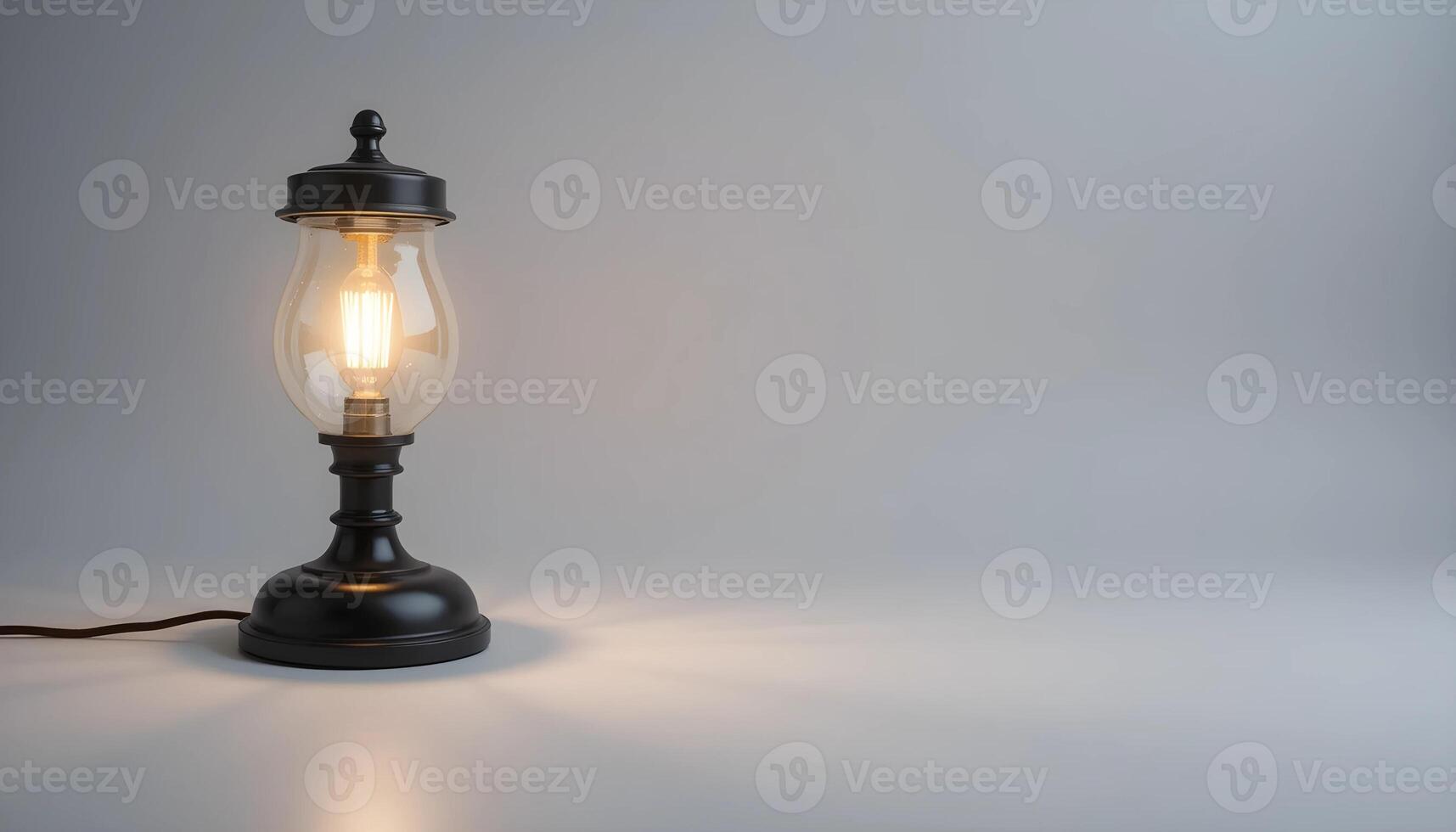 An old fashioned lamp with a light bulb on a table photo