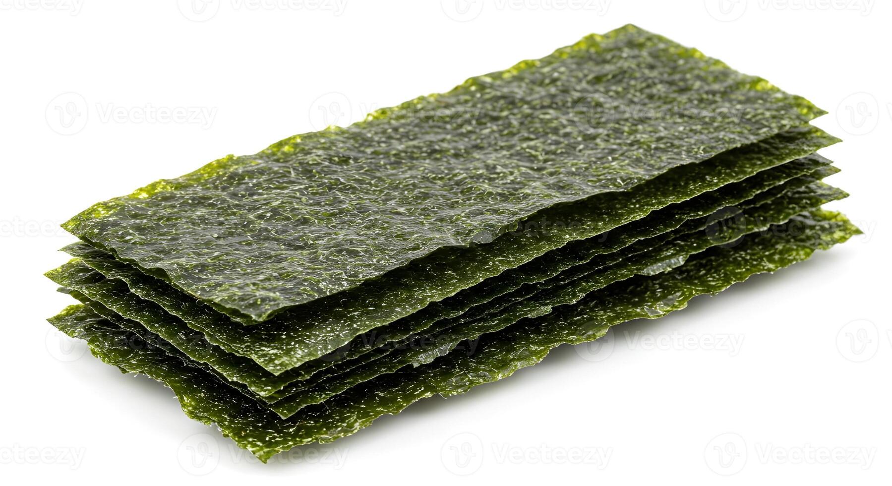 Stacked, dark green, textured sheets of nori seaweed on white. photo