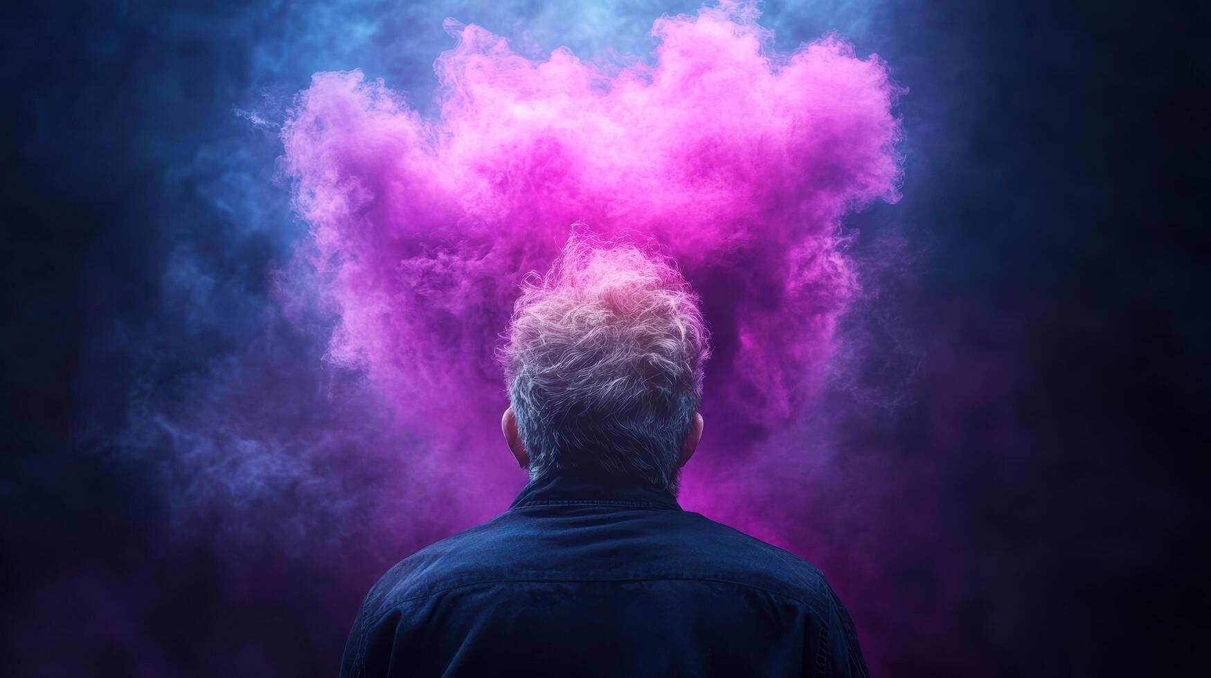 A man is looking at a cloud of pink smoke photo