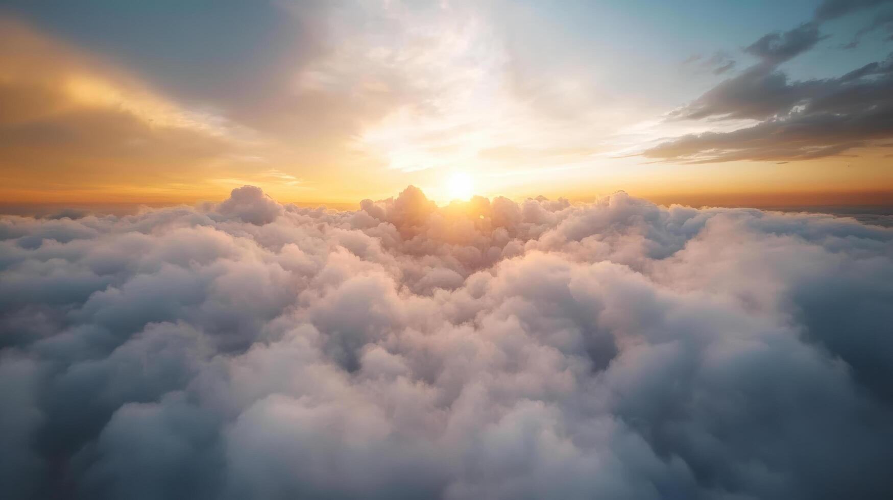 The sun is rising over the clouds in this photo