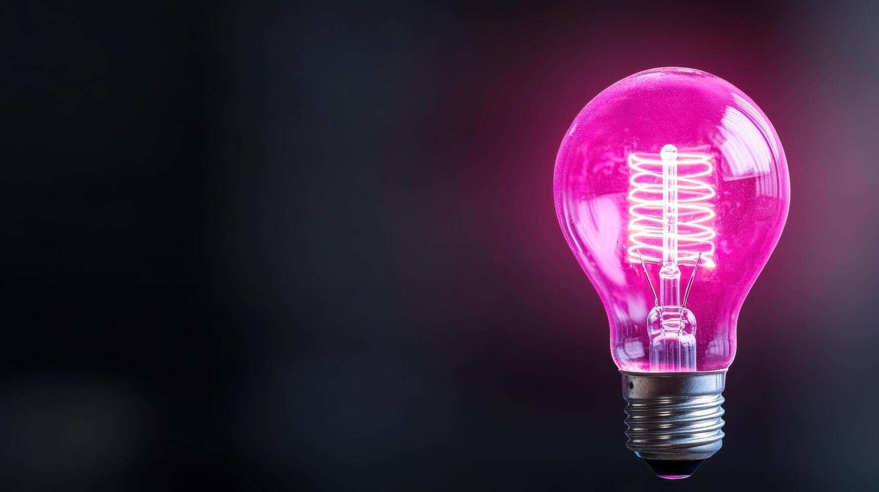 A pink light bulb with a light bulb inside photo