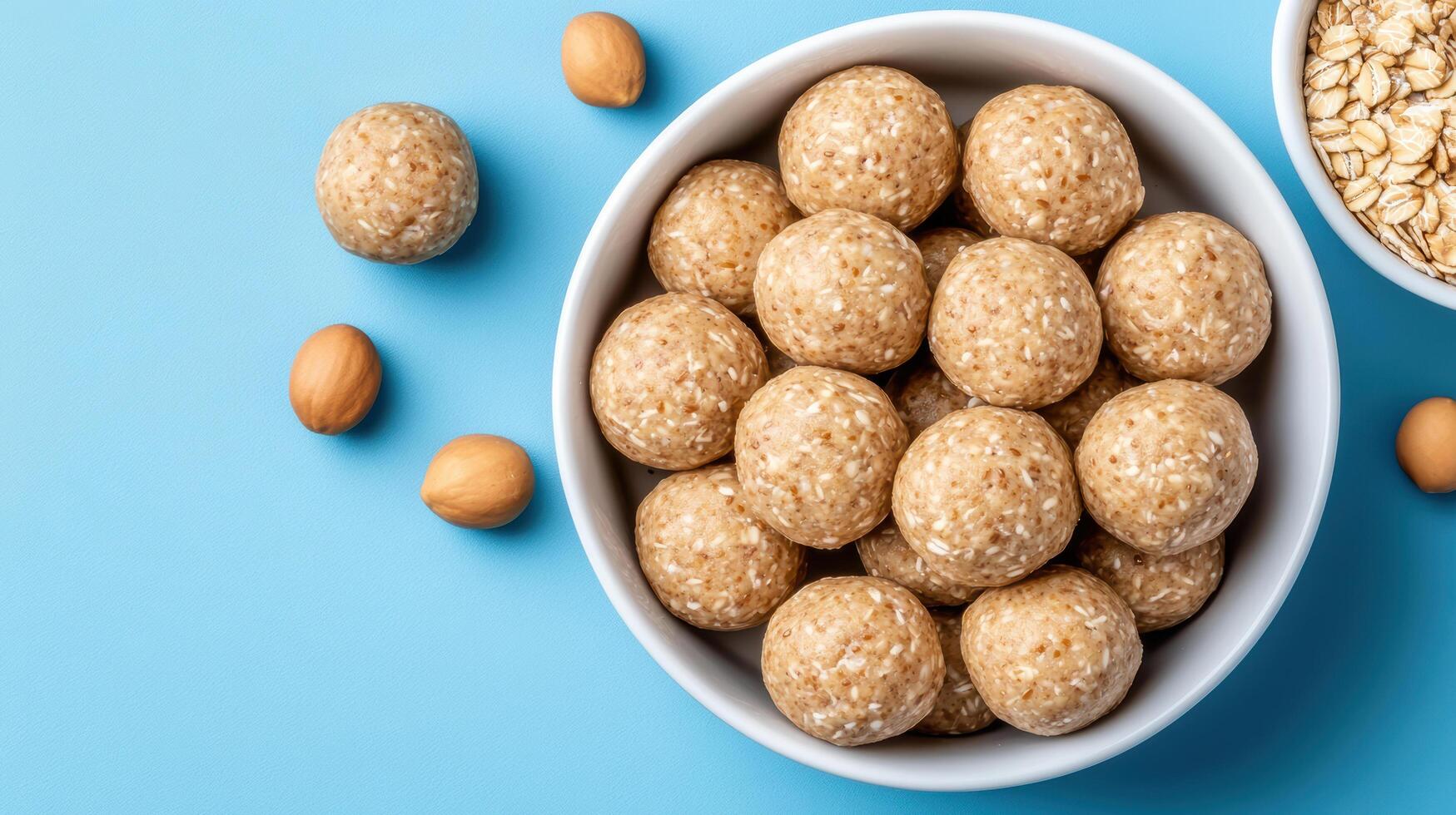A bowl of oatmeal and almonds on a blue background photo