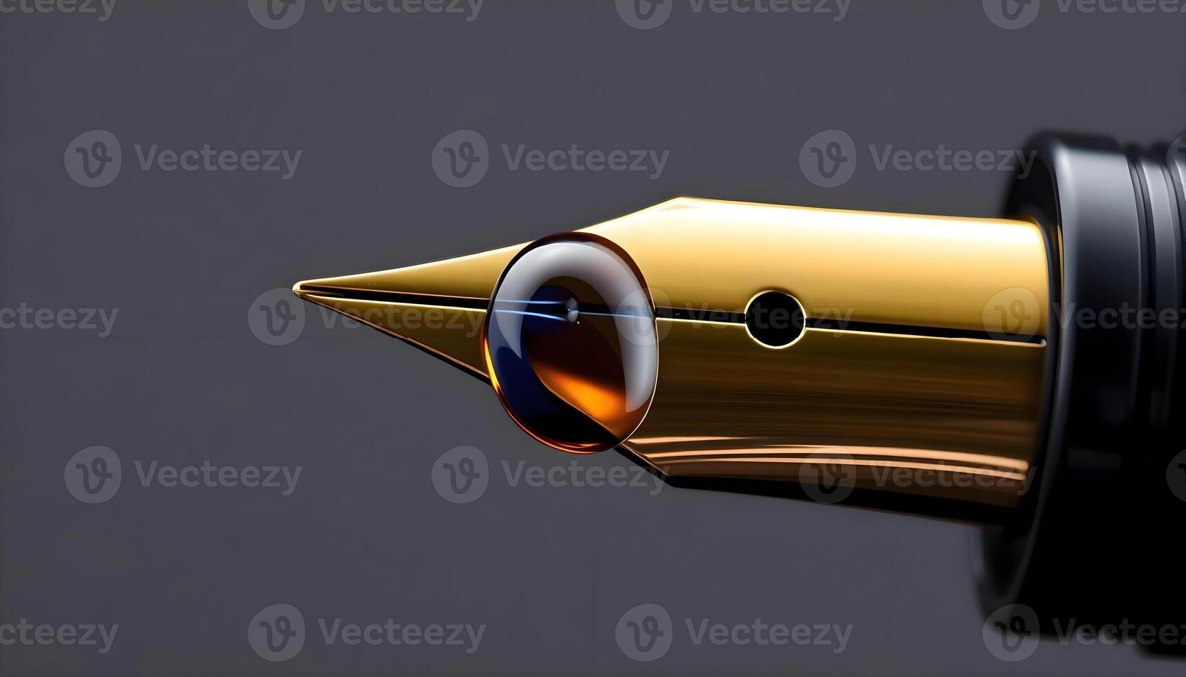 a close up of a gold pen with a black background photo