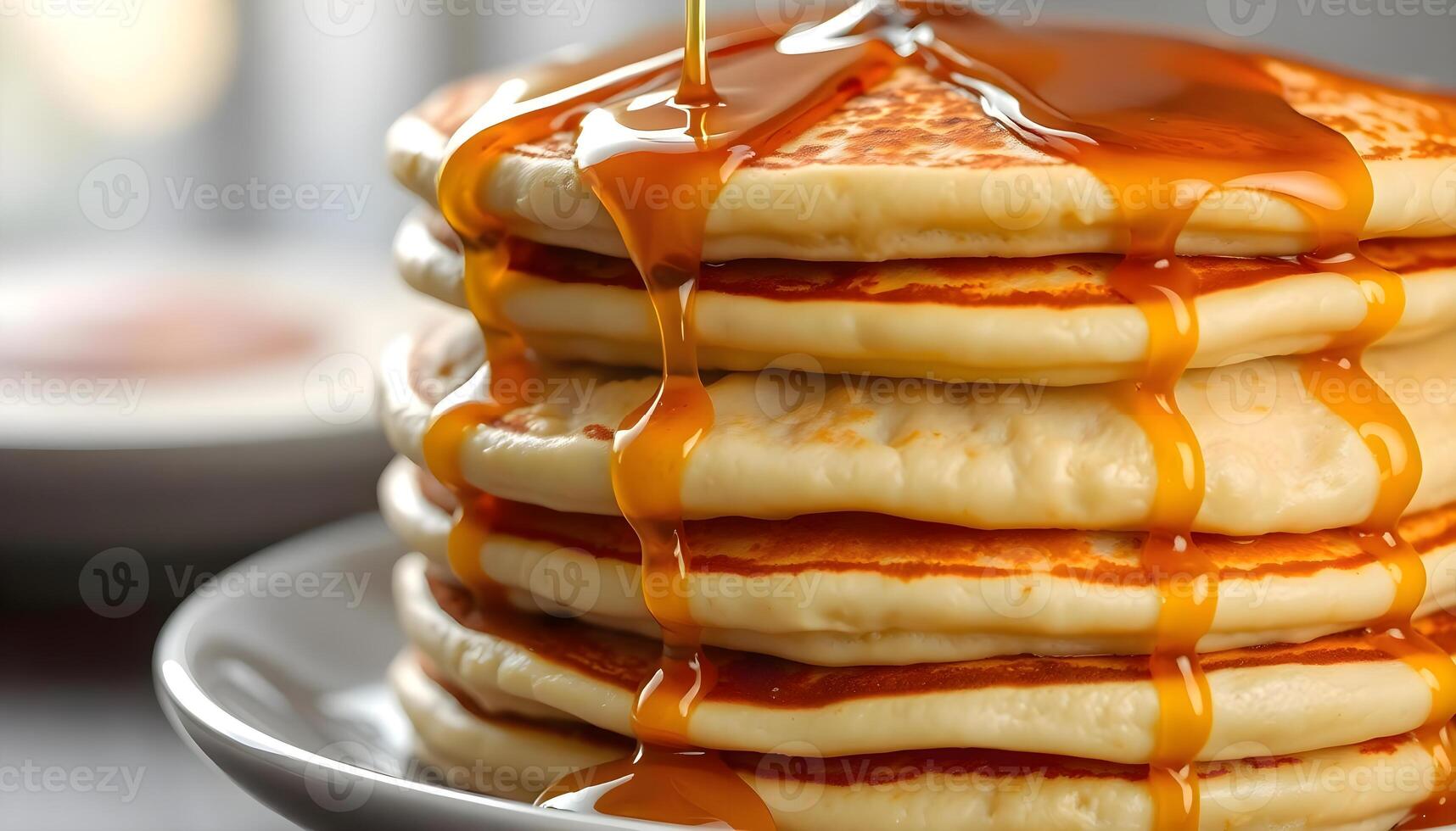 a stack of pancakes covered in syrup on a plate photo
