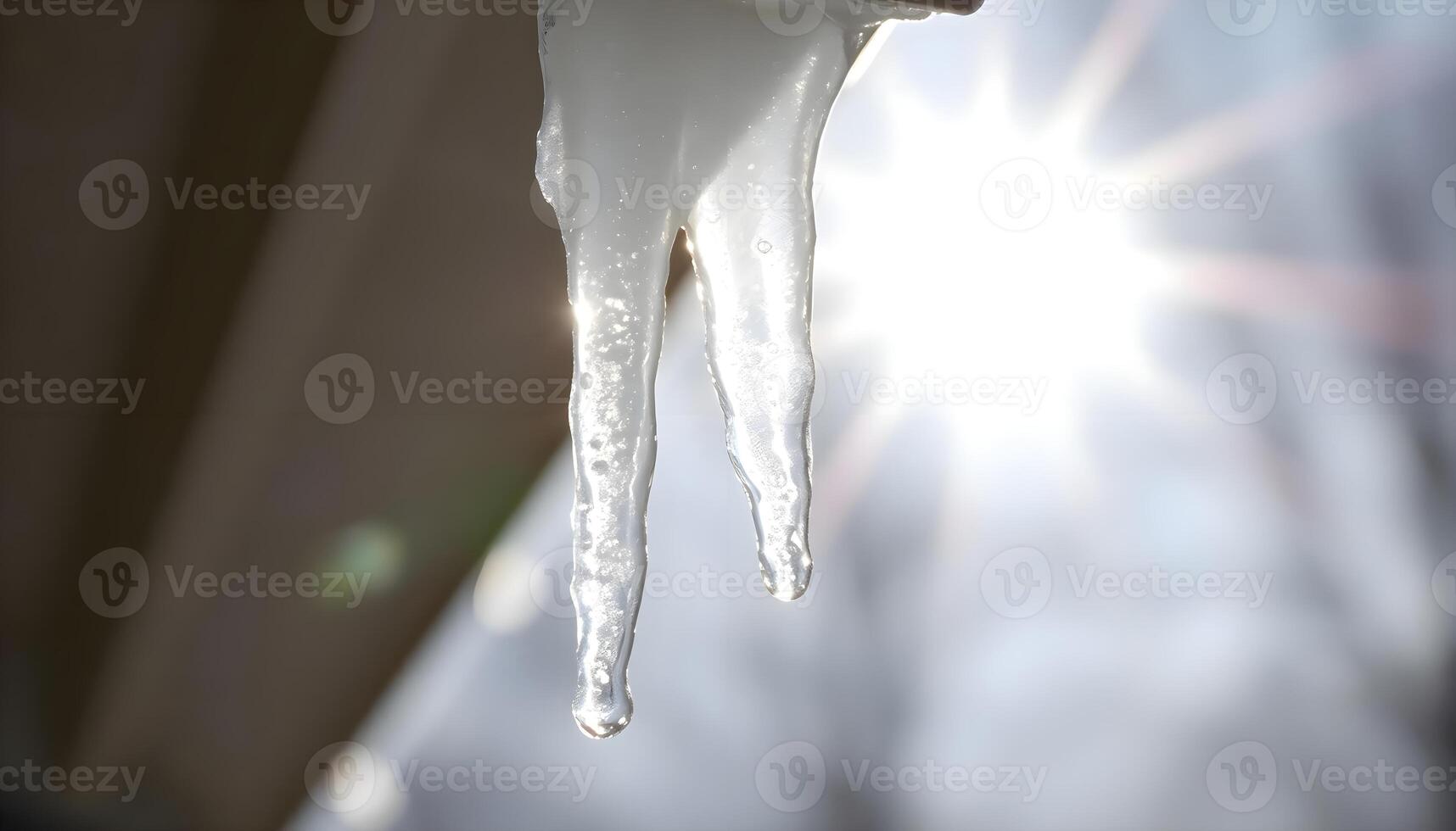 a close up of a icicles hanging from a window photo