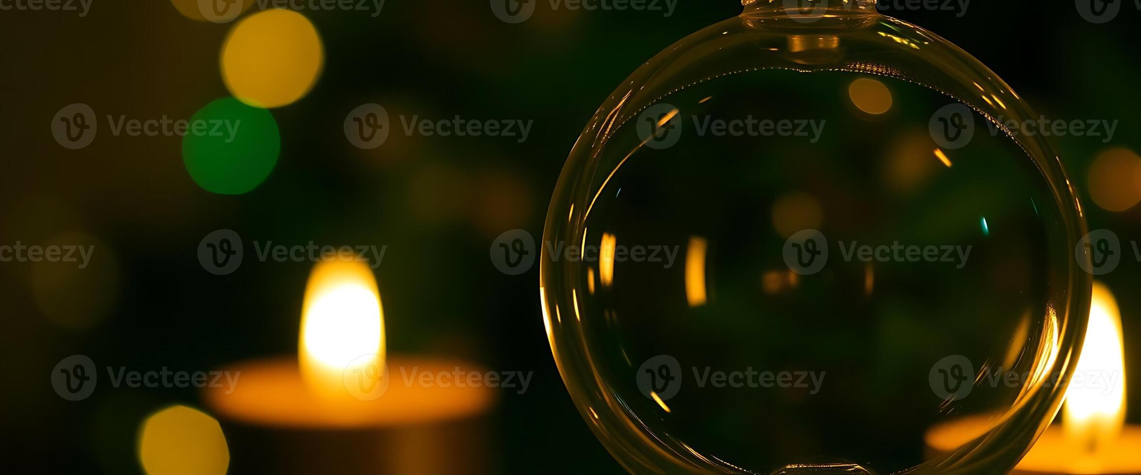 close up of a glass ball with candles in the background photo