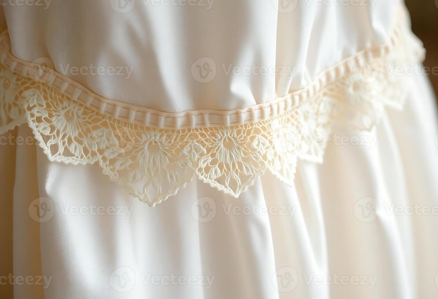 close up of a white dress with a lace belt photo