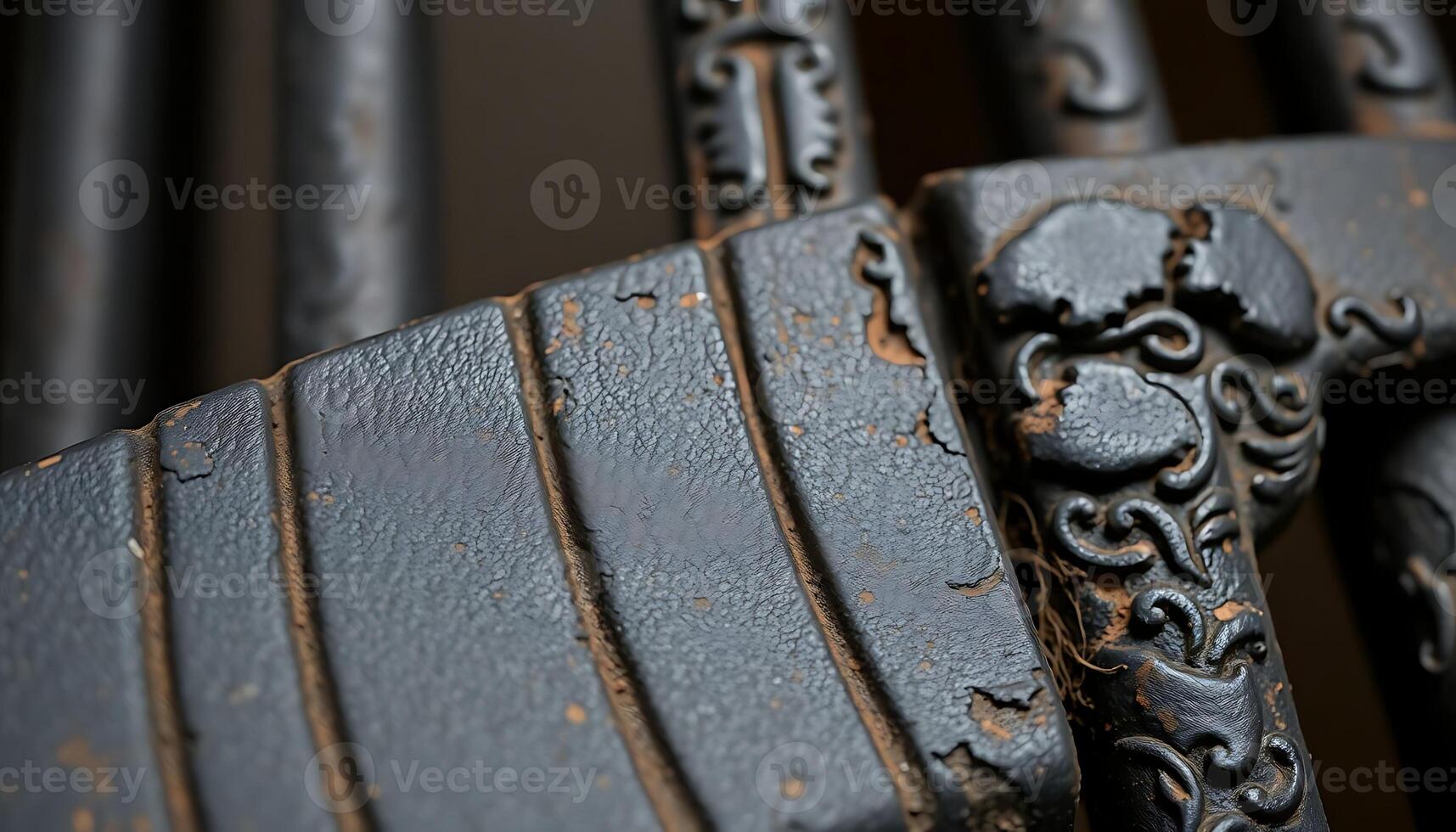 close up of a metal fence with a design on it photo