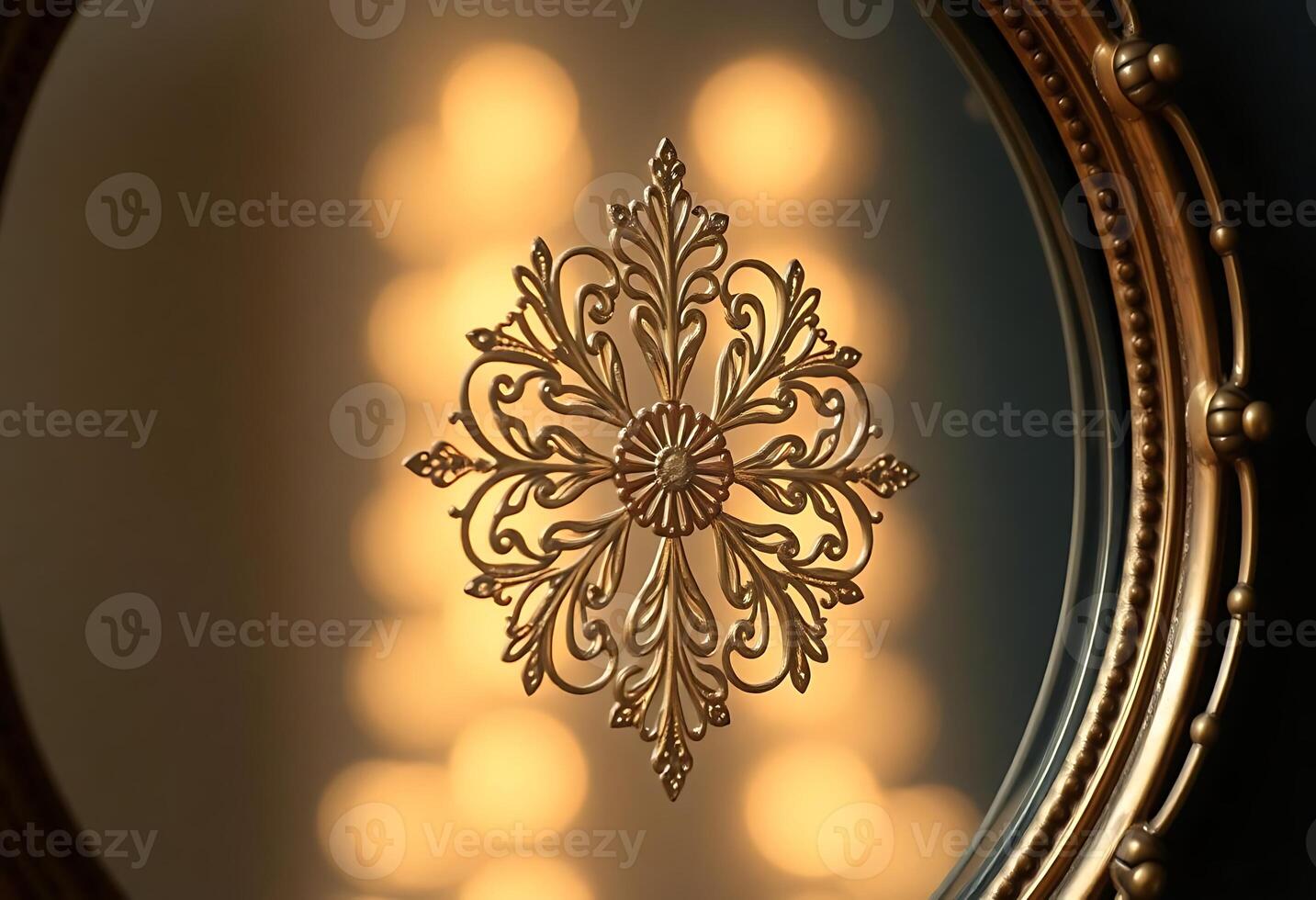 mirror that has a gold snowflake on it photo