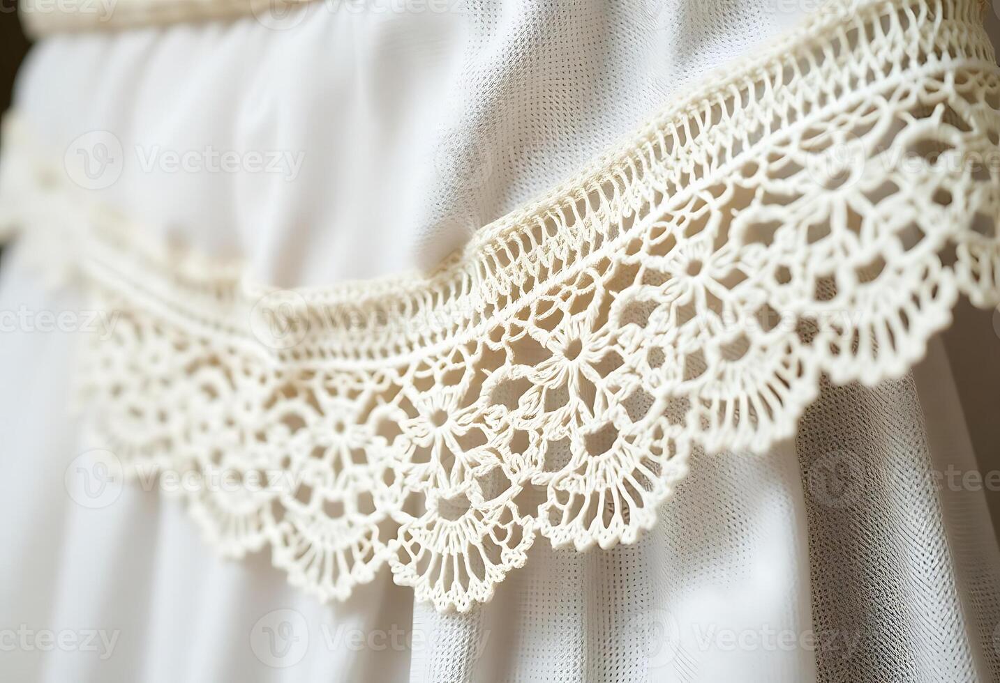 close up of a white dress with crochet photo