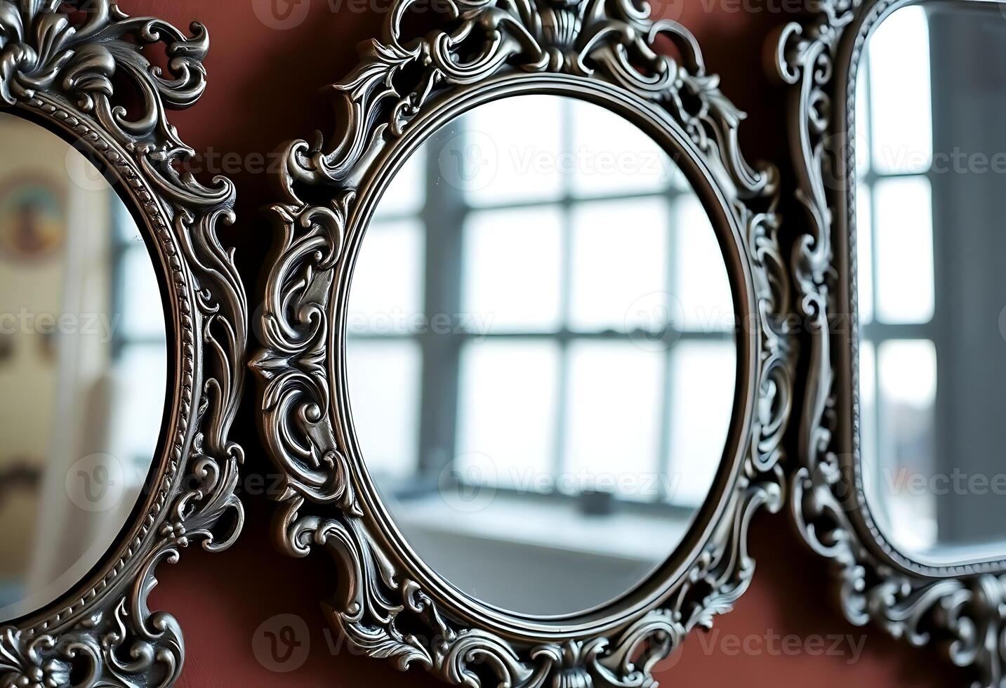 wall with three mirrors hanging on it photo