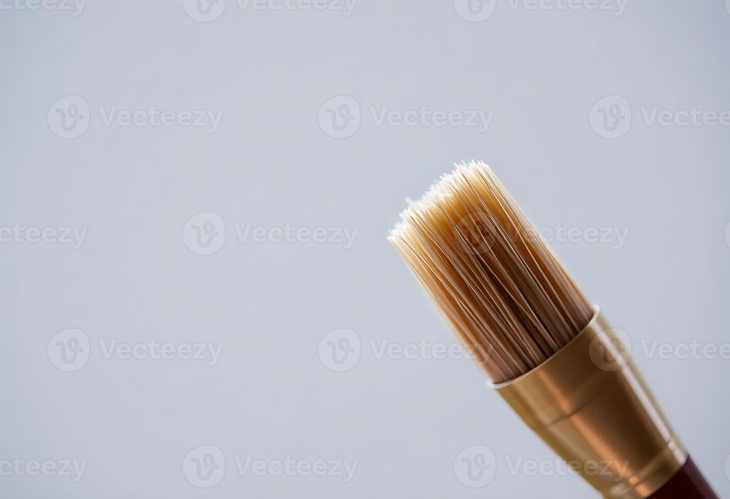 close up of a brown and gold colored brush photo