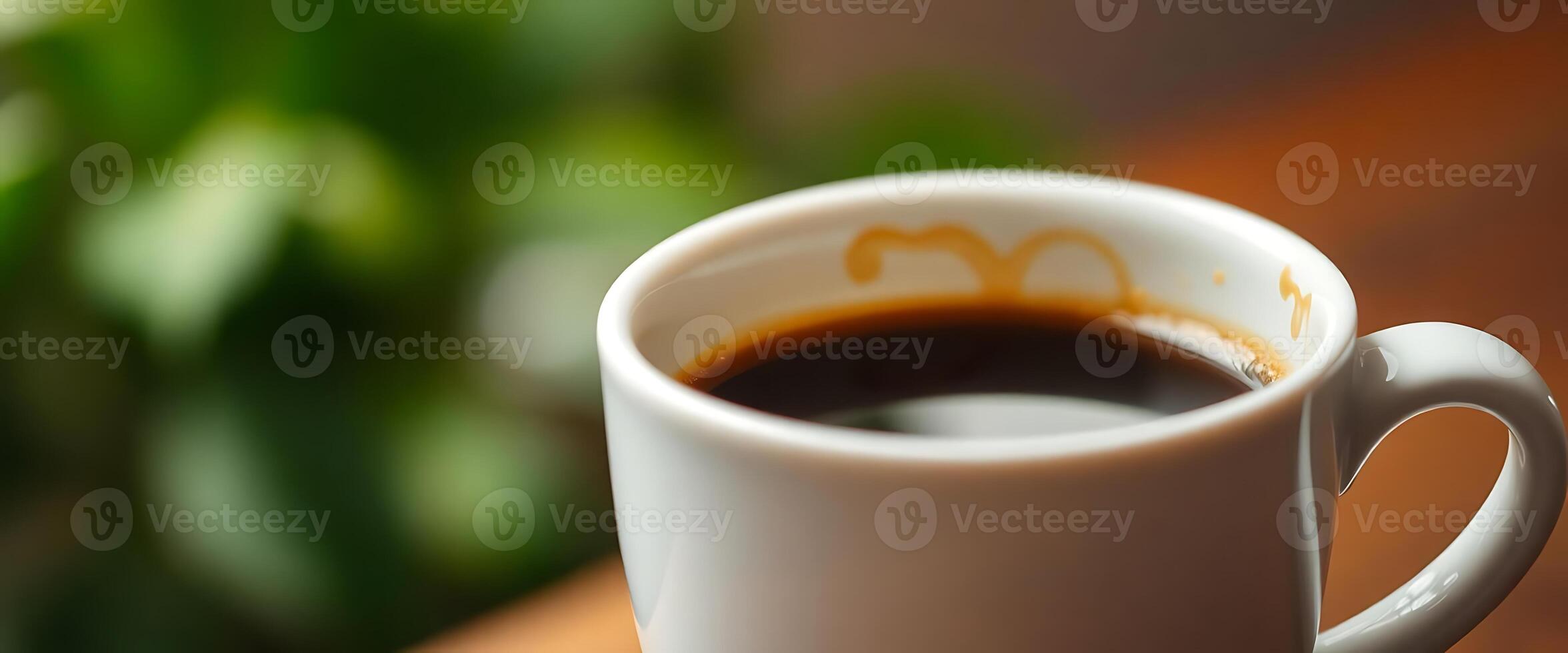 cup of coffee sitting on top of a table photo