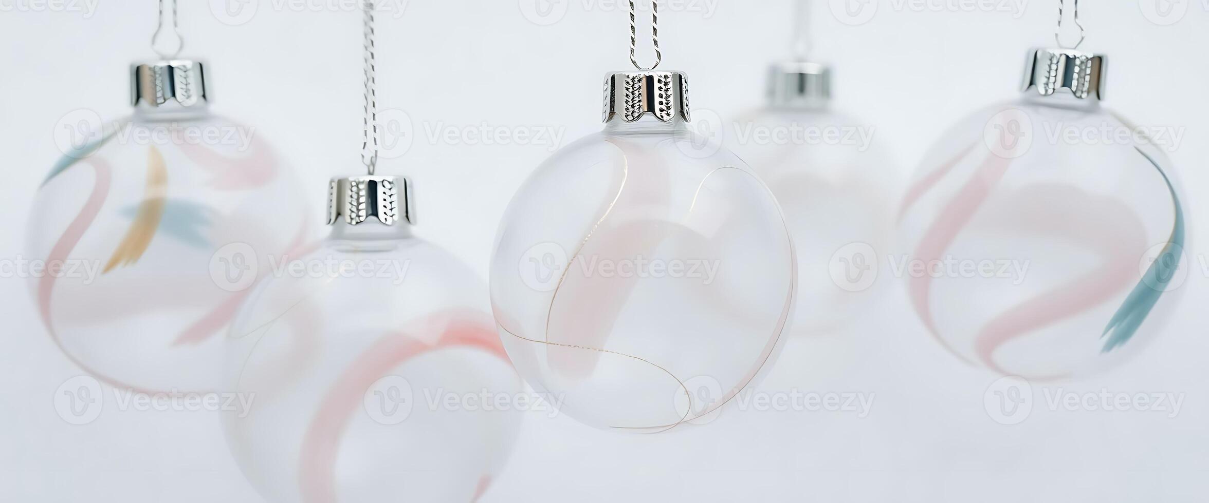 group of three glass ornaments hanging from a chain photo
