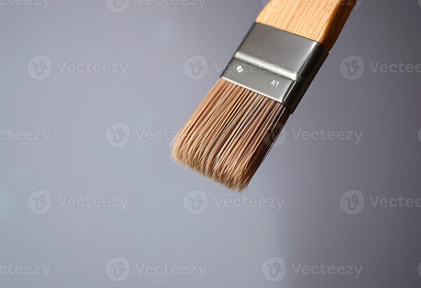 close up of a paint brush with a gray background photo