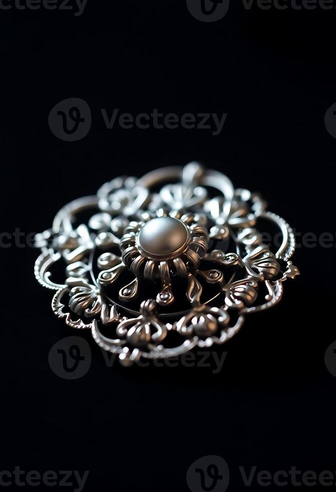 close up of a metal object on a black surface photo