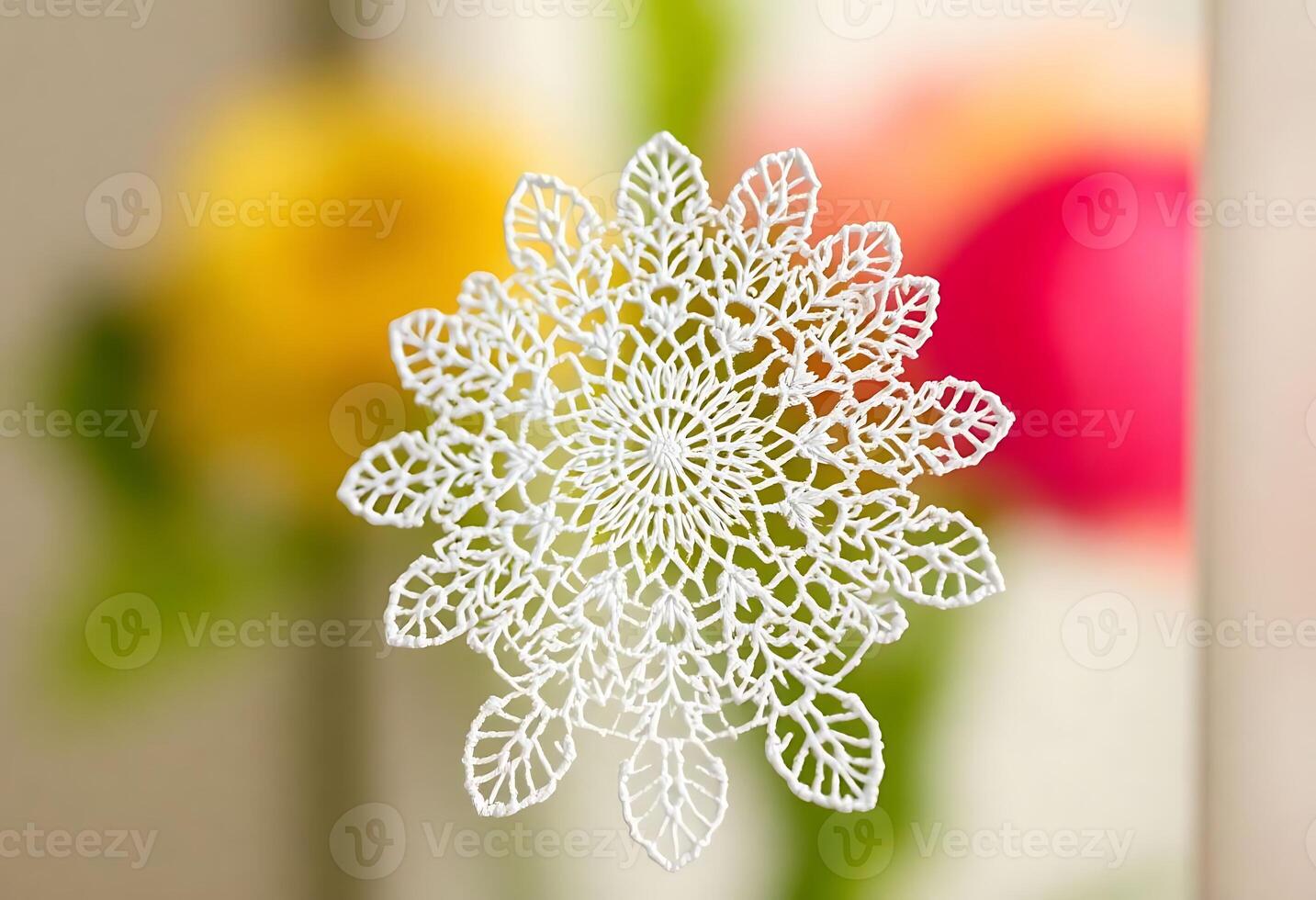 white paper snowflake sitting on top of a table photo
