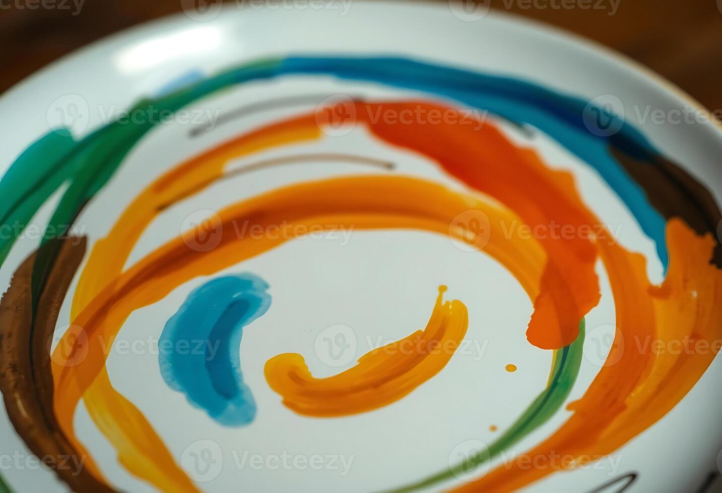 white plate with a colorful swirl painted on it photo