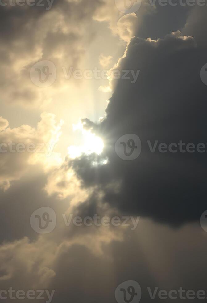 sun is shining through the clouds in the sky photo