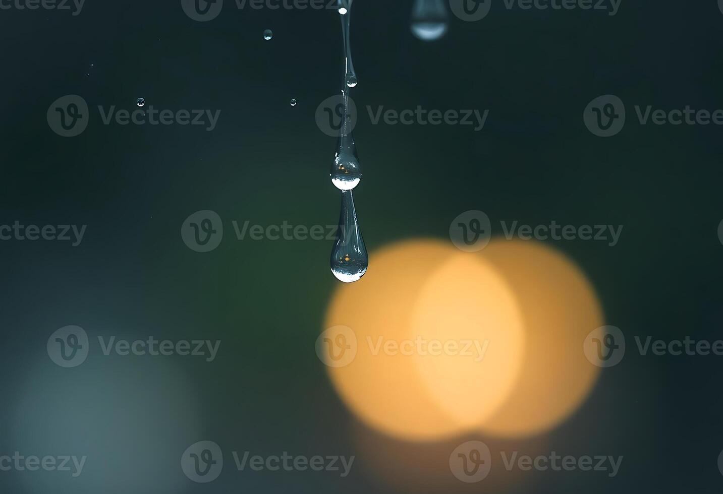 drop of water hanging from a faucet photo