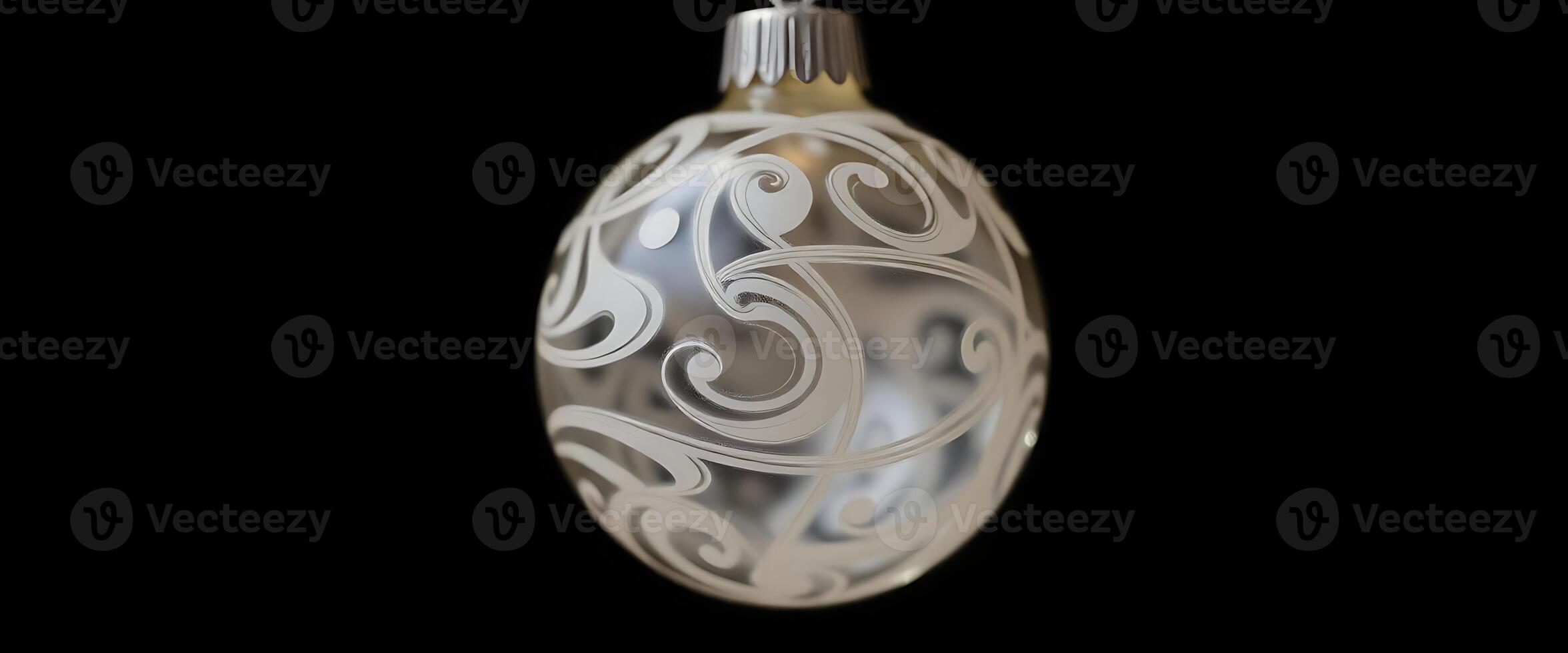 glass ornament hanging on a black background photo