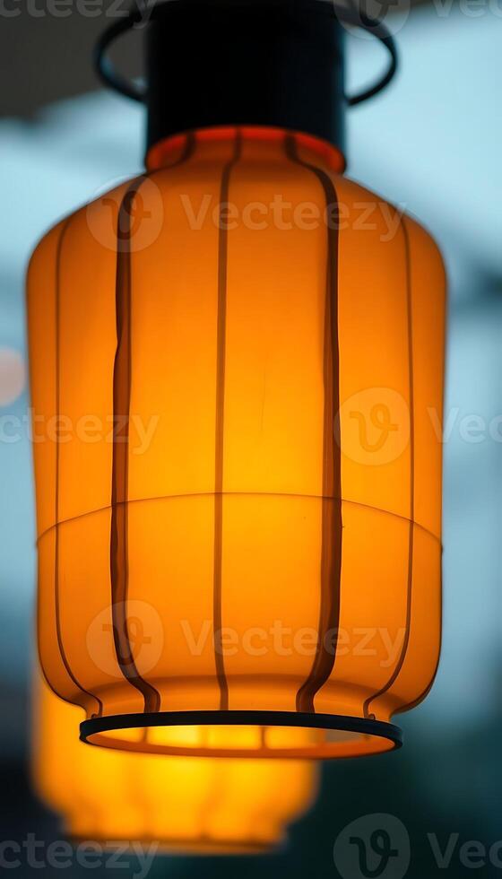 yellow light hanging from a ceiling in a room photo