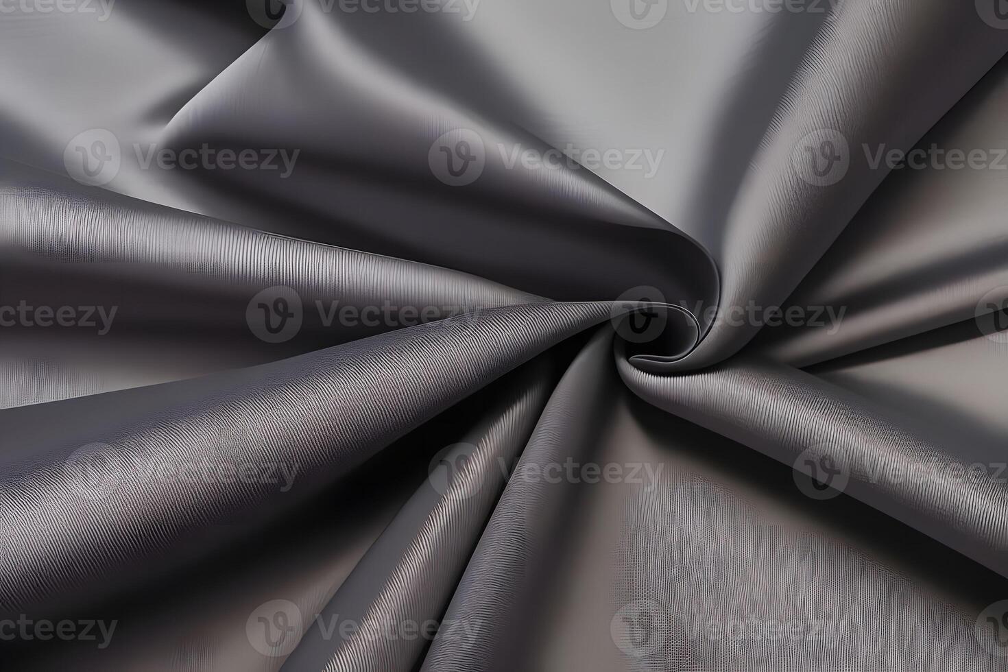 Elegant draped gray fabric showcases a beautifully textured surface, adding a touch of sophistication to any setting. photo