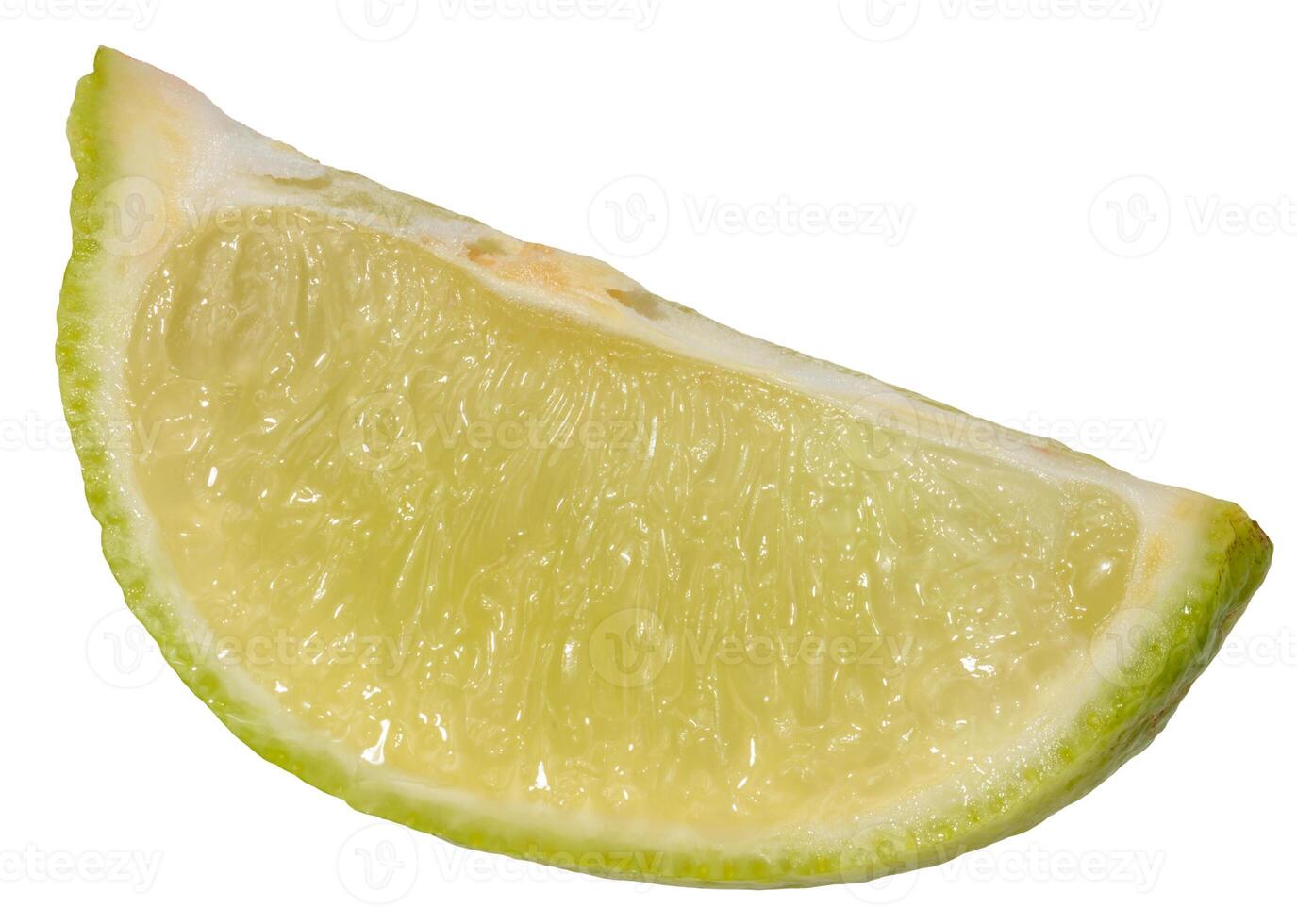 Close-up of a fresh lime wedge with juicy pulp and a bright green peel, isolated background photo