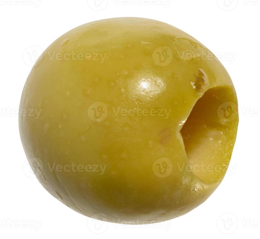 Single, smooth, pitted green olive, isolated background. The olive has a characteristic oval shape with a hole where the pit was removed. photo