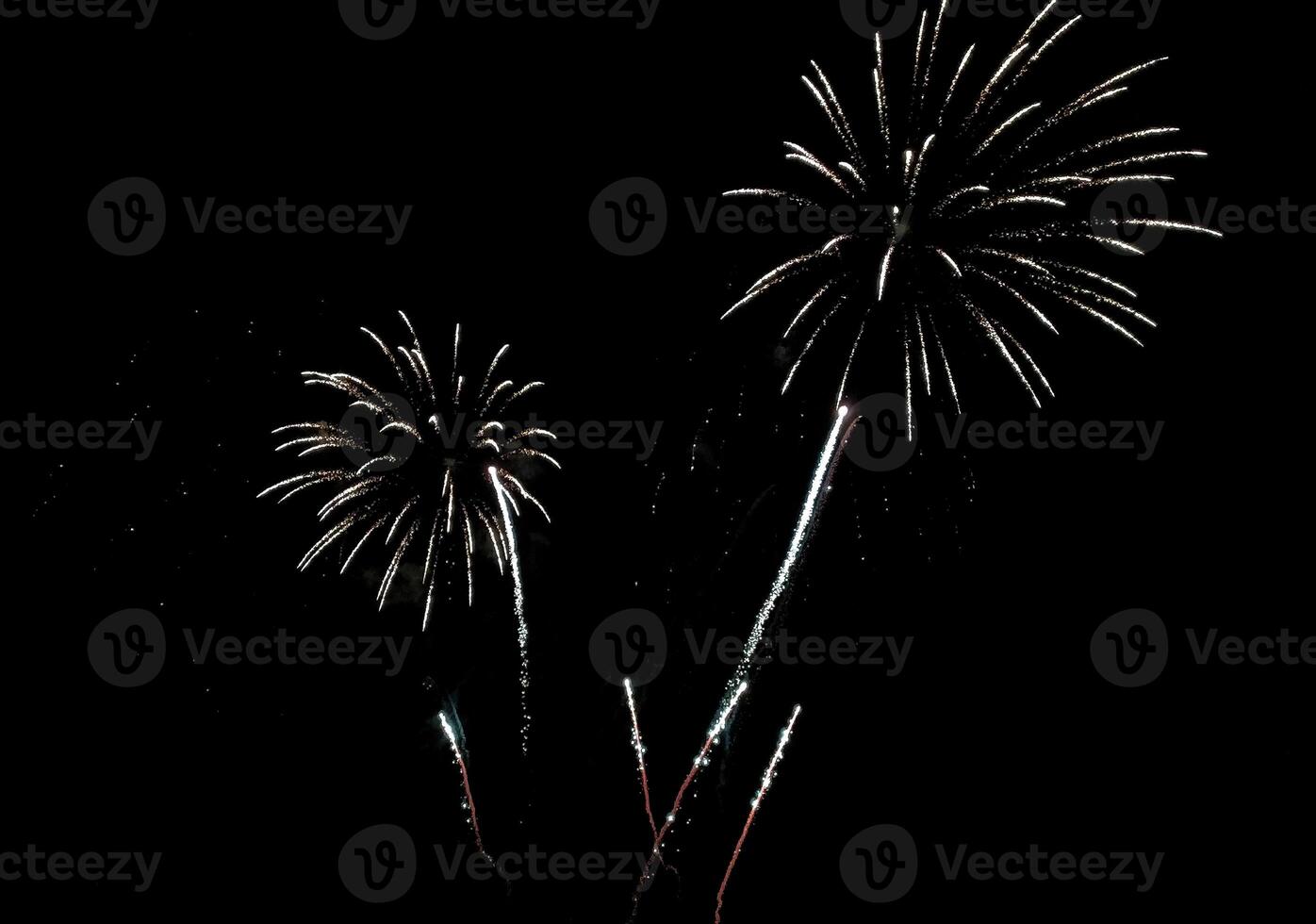 Stunning fireworks display against deep black night sky. photo