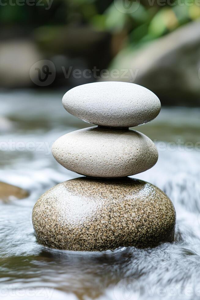 Stacked pebbles in river provide visual zen Symbolizes balance, calm, wellness, and serenity photo
