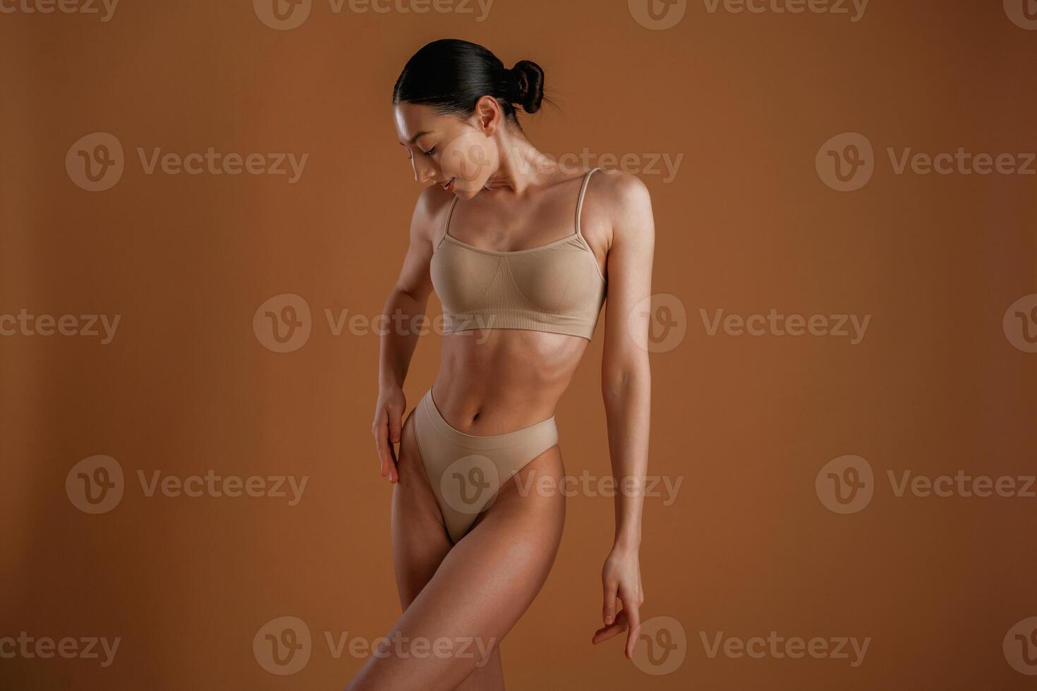 Fitness slim body ,shape. Woman is posing against background photo